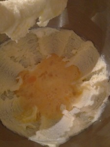 Eggy milk mixture into sugary buttery mixture